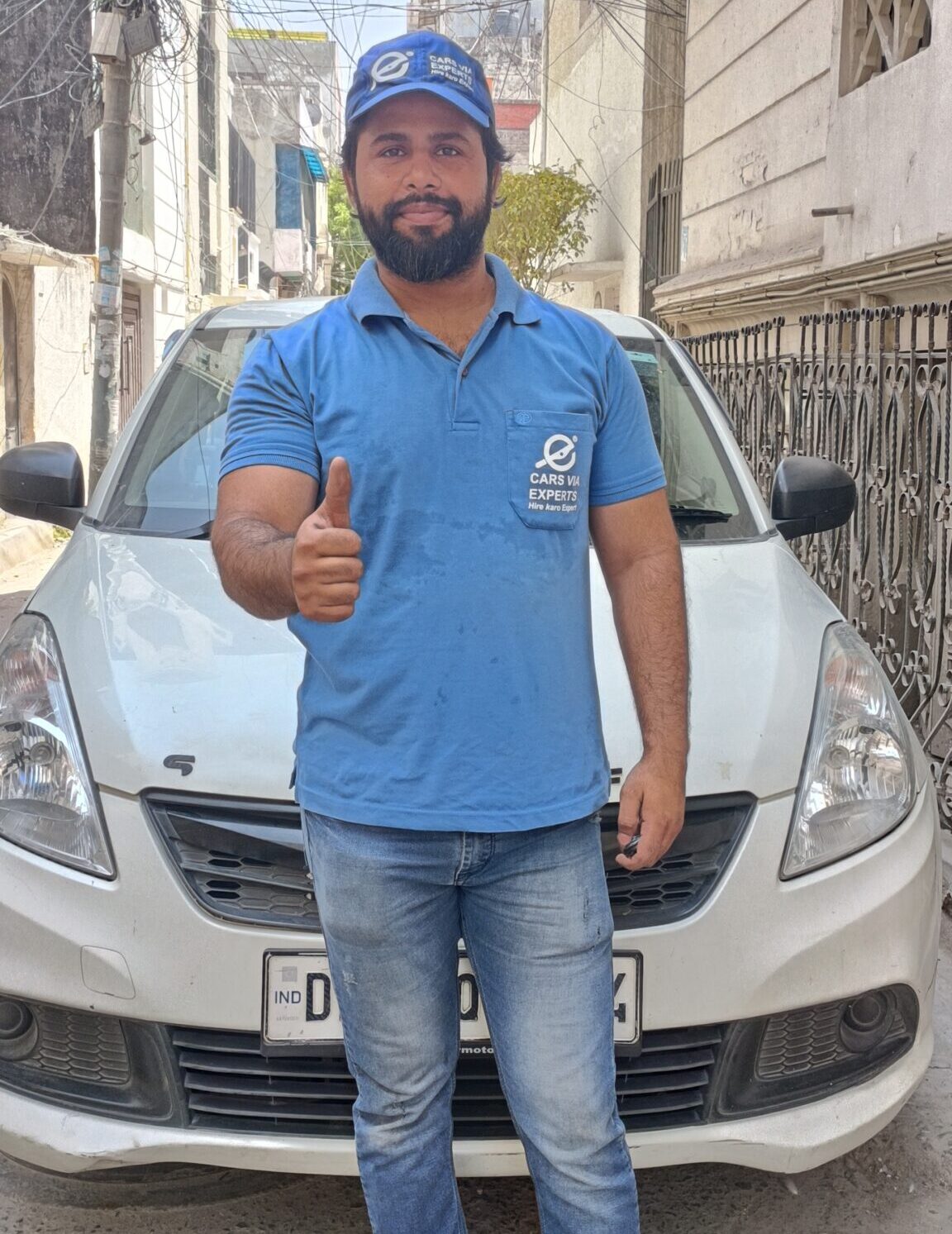 a man standing in front of a car